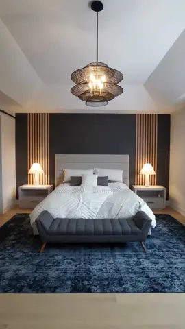 Let us transform any room in your home or office with one of our custom feature walls.  We used a beautiful Wrought Iron paint colour for the wall with oak wood fluted slats. This is one of our all time favorite styles.  We service all of Ontario Canada  Follow us for more @brokenskulldesigns . . . #accentwall #luxury #bedroom #ontario #bed 