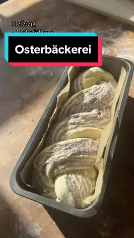 REZEPT: Hefeteig plus Mohnfüllung 🐣 Ich habe spontan einen Hefezopf mit Mohnfüllung zu #Ostern gebacken, aber damit er gut zusammenhält ist der Teig wie Babka in einer Form gelandet. Nun ist die Frage, zählt das #Rezept als Babka? 🤔 Ihr kennt ja bereits mein #Grundrezept für einen luftig-leichten Hefeteig. Aber diesmal wollte ich etwas Besonderes ausprobieren. Inspiriert von der traditionellen #Babka habe ich einen #Hefeteig mit einer köstlichen #Mohnfüllung zubereitet. Hier ist das Grundrezept für den Teig: Zutaten für den Teig: - 50 ml warme Milch - 1/2 Hefewürfel (frisch) - 1 TL Zucker - 530 g Mehl - 65 g Zucker - 1 Pck. Vanillezucker - 1 Pr. Salz - 250 ml Milch - 75 g Butter - 1 Ei Anleitung: 1. Löse zuerst die Hefe mit einem Teelöffel Zucker in warmer Milch auf und stelle die Mischung 10 Minuten beiseite.     2. Vermische in einer Schüssel Mehl, Zucker, Vanillezucker und eine Prise Salz.     3. Erwärme in einem Topf die Milch mit Butter, bis diese schmilzt.     4. Bildet eine Kuhle im Mehl und gießt die Hefemischung hinein. Bedeckt diese mit Mehl und lasst es 15 Minuten ruhen.     5. Füge nun das Ei hinzu und gieße die warme Milch-Butter-Mischung darüber.     6. Knete alles zu einem geschmeidigen Teig.     7. Lass den Teig abgedeckt an einem warmen Ort für 60 Minuten gehen.     ✨ GEHEIMTIPP ✨ Schlage den Teig dann 100-mal auf eine gemehlte Arbeitsfläche und lass ihn weitere 60 Minuten gehen. Du wirst den Unterschied merken, versprochen!     Für die Füllung habe ich eine Mischung aus fertiger Mohnbackmasse (400 g Mohnback), restlicher Buttercreme (ca . 100g) und Quark (ca. 100 g) verwendet.  Die genaue Zubereitung und wie ich den Hefeteig verzwirbelt habe, zeige ich euch heute noch in einem separaten Video auf meinem Profil. ❤️ Jetzt bin ich gespannt, was ihr zu meinem Hefeteig mit Mohnfüllung sagt! 🤗 #Osternbacken #Backrezept #Hefeteigliebe #Hefeteigrezept #Osterbäckerei 