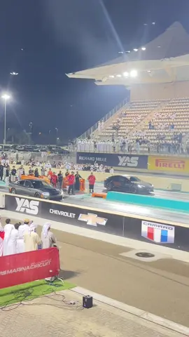Drag race dodge vs tesla . Abu Dhabi Yas marina circuite #drag #racing #reels #trending #sportscar #tesla #dodge 