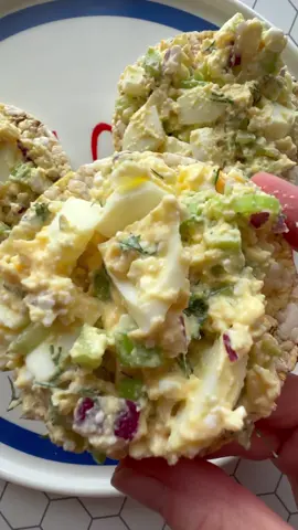 High protein egg salad.. having boiled eggs prepped in the fridge is a game changer. It means you can make an easy healthy snack or lunch in under 5 minutes  Ingredients: 2 boiled eggs 1/4 cup cottage cheese 1 teaspoon dijon mustard  1 teaspoon lemon juice Salt and pepper (optional) 1 celery stick, chopped 1/4 red onion, chopped 1 teaspoon fresh dill, chopped  In a bowl, add egg yolks, cottage cheese, dijon mustard, lemon juice, salt and pepper. Mix until well combined. Chop up the egg whites. Add chopped egg whites, celery, red onion and dill to the bowl. Stir until well combined. Add egg salad to rice cakes, corn thins, toast, a sandwich or lettuce cups. Enjoy!  * I boil the eggs in my air fryer.. 10 minutes on 130 degrees celsius, then place into an ice bath #easylunch #healthylunchideas #snacks #healthysnacks #eggsalad #highprotein #mealprepideas