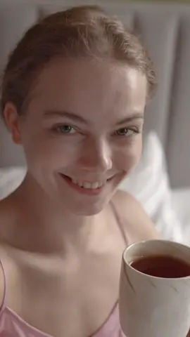 Close up of a woman drinking a coffee. 