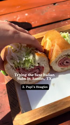 On episode 2 of trying the best Italian subs we try @atx_hoagies  aka Papis!  They are location in East Austin at the @arborfoodpark  We got their Italian for 12 dollars. From the website (This classic cold cut Italian is a fan favorite. Amazingly well aged meats combined with traditional oil & vinaigrettes, it will have you coming back for more. The Goods:  Prosciutto, Hot Capicola, Natural Casing Genoa Salami, Provolone Cheese, Mayo, Lettuce, Tomato, Onion & Oil Vinaigrette) Thoughts? I believe I saw somewhere the owner was from New Jersey? Anyway, the sandwich is supposed to come with mayo and that’s a huge nope for me in Italian subs so I asked for no mayo. The actual sandwich is very compact and a bit small imo. I would say I could probably eat 2 to get full. The bread is baguette bread and it was very fresh and soft. Low key the compactness and way it was made really reminded me of banh mi. The flavors overall was good and I would order it again. I liked the taste of the meats as well. I want to go back and try their De Niro sandwich! #atx #austinfoodadventures #atxfoodtime Italian subs in Austin 