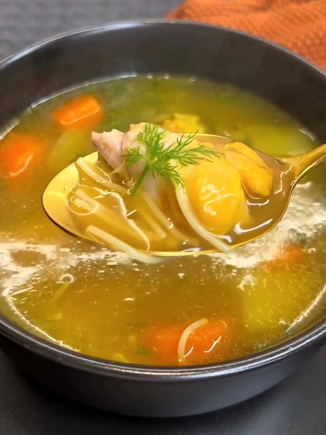 Nature's penicillin: Authentic Jewish chicken soup by @oshritabergil Soup: 4 chicken drumsticks 1 leek, cubed 2 onions, cubed 2 carrots, cubed 1 kohlrabi, cubed 4 celery stalks including leaves, cubed Bouquet garni: A bunch of thyme, parsley, and dill tied together 1 teaspoon turmeric ½ teaspoon black pepper 1 tablespoon salt 3 tablespoons olive oil 3 liters boiling water A handful of parsley, chopped (optional) Pasta: 2 cups thin egg noodles Boiling water to cover 1 teaspoon salt 2 tablespoons oil Soup: In a deep pot, sauté the onions, chicken, and vegetables in olive oil. Add water, spices, and the bouquet garni. Bring to a boil and simmer for 10 minutes, then reduce heat and cover for an hour and 15 minutes. Remove the bouquet garni, turn off the heat, and add a handful of chopped parsley and savory. * You can add root vegetables, zucchini, potatoes, etc. * For a clear soup: remove the vegetables and chicken at the end of cooking; you can debone the chicken and return it to the pot. Pasta: Place the pasta in a pot with boiling water until covered, stir, and cook for 3-4 minutes. Drain and rinse with water, then return to the pot, add salt and oil, and mix. #yummyfood  #cleanfood  #tastyrecipesvideos  #yummyfoodrecipes  #mealinspo  #chickensoup  #souprecipes  #jewishrecipes  #passoverrecipes  #passoverfood  #passover2024