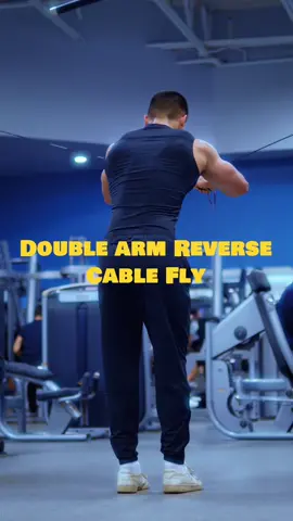 Rear Delts - Double Arm Reverse Cable Fly 1. Stand with feet shoulder-width apart, knees slightly bent, and core engaged. 2. Hold cable handles with overhand grip, palms facing each other, arms extended in front at shoulder height. 3. Squeeze shoulder blades together as you pull handles outward and backward in wide arc. 4. Keep elbows slightly bent, maintain tension in rear delts throughout movement. 5. Inhale and slowly return to starting position with control, focusing on full range of motion and a full stretch.  Advantages of Double Arm Reverse Cable Fly: Increased Range of Motion: Using cables allows for a smoother and more controlled range of motion compared to free weights, leading to better muscle engagement and reduced risk of injury. Improved Posture: Strengthening the rear delts helps counteract the effects of rounded shoulders and forward head posture, promoting better overall posture and alignment. Injury Prevention: Developing strength in the rear delts can help prevent shoulder injuries by stabilizing the shoulder joint and reducing the risk of impingement.   Enhanced Shoulder Aesthetics: Building well-defined rear delts contributes to a balanced and aesthetically pleasing shoulder profile, enhancing the overall appearance of the upper body. Mistakes to Avoid: Using Excessive Weight: Avoid using too much weight, as it can compromise form and lead to swinging. Rounded Shoulders: Keep the shoulders pulled back and down throughout the movement to ensure proper engagement of the rear delts and prevent strain on the neck and upper back. Limited Range of Motion: Focus on achieving a full range of motion by squeezing the shoulder blades together at the end of each rep and allowing the arms to fully extend at the bottom of the movement. Incorrect Body Positioning: Maintain a stable stance and avoid leaning too forward or backward. This can shift the focus away from the rear delts. Follow me for more fitness tips and exercises! 💪🏻 #gym #gymmotivation #cinematic #gymcinematic #Fitness #aesthetic #motivation #bodybuilding #training #workouts #shoulders #trufit #explorepage #shoulderworkout #reardelt #reardeltexercises #fitnesstips #gymtips
