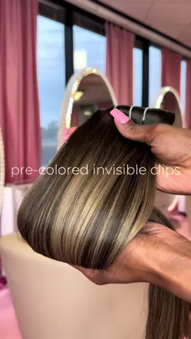 Our invisible clip-in extensions come pre-colored, which means you don’t have to go through the hassle of coloring them. They are made with high-quality, seamless, straight hair and are available in the Aruna shade, which gives you a natural and flawless look. The Aruna shade has a level 3 base with level 9 highlights, making it a versatile option that complements a wide range of skin tones. The same deminsion is available witha natural black base.  Whether you want to add volume to your everyday look or want to look glamorous for a special occasion, our Invisible Clip-in Extensions Aruna is the perfect solution. You can get beautiful and luxurious hair in no time with our easy-to-use clip-ins. #clipins #houstonclipins #dallasclipins #invisibleclipins 
