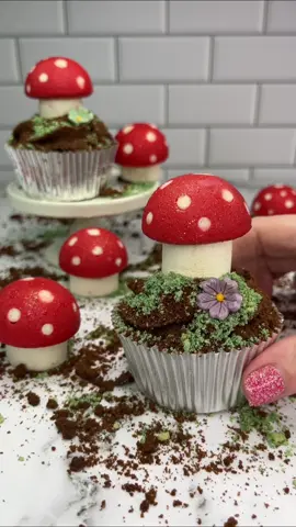 Buttercream toadstools 🍄❤️ I used a silicone cake pop mold for these Pipe small white buttercream spots into your silicone mold FREEZE 🥶 for 15 minutes Add red buttercream into the mold, followed by your marshmallows  FREEZE 🥶 again for 15 minutes. Push them out of the mold and keep them in the fridge until you’re ready to use 🍄 I added a swirl of chocolate buttercream, crushed chocolate biscuits and some edible moss to my cupcakes.  Sit your toadstools on top   I then added edible glitter for some extra sparkle ✨ VOILA #cupcakes #toadstools #cakedbyrach #cakeart #cupcakedecorating #caketok #cutecore 