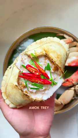 National Dish of Cambodia : AMOK TREY (Coconut Fish Curry). Which is traditionally made with fish, but we’re switching things up with crab. MY FAVORITE!  INGREDIENTS: - (2) crab    - 1 large egg  - Handful of kaffir lime leaves  - 5 stocks of roughly chopped fresh lemongrass - 2 red shallots   - Handful of kaffir lime leaves  - 3 knobs of tumeric root or (2 tbsp of turmeric powder)  - 3oz of roughly chopped galangal root  - 16 cloves of garlic   - (3) Presoaked Guajillo chili pods   - 1 to 2 cups of water varying on consistency desired  *This Kroeung recipes makes (3) 16oz containers which you can freeze up to 12 months*  INSTRUCTIONS: 1. For the Kroeung, combine all the perishable ingredients above into a food processor and pulse into a paste  2. Dispatch crab legs and add the legs under a steamer on high heat for 8 mins  3. Once fully steamed, remove from the basket to cool then remove the crab meat from the shell  4. Set aside  5. Into a bowl, carve out the crab butter & add the crab meat, 1.5 tbsp of kroeung, 1 tbsp of fish sauce, 2 tsp of msg, 1/2 tbsp of palm sugar (not pictured), & 1 egg  6. Mix well, then ladle the crab blend into the crab shell 7. Set the steamer on high heat, add the crab & cover  8. Steam for 10mins  9. Remove from the steamer & let it cool 10. Add coconut cream  11. Garnish with thin slices of kaffir lime leaves & Thai chili peppers 