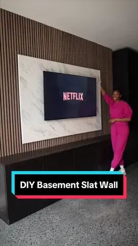 The easiest DIY slat wall ever. I love how this came together to serve as the focal point for rhe basement game room. The slats were measure, cut & nail 🙌 the faux marble piece & LED lights added the chef’s kiss #diyproject #diytok #diyhome #diyhomeprojects #slatwall #accentwall #basementrenovation #basementdesign 