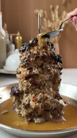 Welcome Back to Episode 76 of All Things 🇬🇷 Greek! Today I am back with a variation of my Chicken Gyro Meat (ya’ll, we started a viral trend!!!)- using the authentic cooking method! Today’s recipe is inspired by meal prep and making your lives easier! So I took your advice and added veggies and potatoes to the base of my vertical skewer pan - GENIUS 🪬If you love delicious, easy, flavor-packed GREEK FOOD then be sure to follow 👩🏻‍🍳🔪@foodbymaria so you never miss a recipe! The full recipe is below or tap the link in my bio to access our website for the recipe and VERTICAL SKEWER PAN. Don’t forget to save this post for later! 📱 💥 You can also access all these recipes on the FoodByMaria App which is available for both Apple and Android. 📱 💥 Gyro is meat traditionally cooked on a vertical rotisserie (or in our case an Amazon pan 😂), then sliced and served wrapped or stuffed in pita bread or pita gyro bowls along with other ingredients such as tomato, onion, fried potatoes, and tzatziki. In Greece, my family normally enjoys Gyro meat with either beef, lamb, or chicken! It’s the perfect protein to have in the fridge all week.  I like pairing it with fluffy rice, my viral pita and a Greek salad! Don’t be afraid of the spice selection, I promise you it’s incredible and a combo you’re sure to enjoy!  Here’s everything you need to become an Authentic Chicken Gyro Meat Expert! Ingredients: Variation: Gyro chicken with vegetables and warming spices  — 2-2.5 lbs boneless, skinless chicken thighs (about 12-16 thighs) 1 tsp salt 1/2 tsp pepper 2 garlic cloves, pressed 1 tbsp dried oregano 1/2 lemon, juiced 1/2 tsp ground cumin 1/2 cup plain Greek yogurt 2 tbsp olive oil 1/2 large white onion, grated 1/4 tsp cinnamon 1/4 tsp all spice 1/8 tsp cloves 1 tsp dried parsley 1/2 red onion, cut into 1 inch pieces 1 red pepper, cut into 1 inch pieces 1 cup baby potatoes  Instructions 1. Make the marinade: add all of the marinade ingredients to a medium sized mixing bowl or baking dish and whisk together (salt, pepper, garlic, dried oregano, lemon juice, ground cumin, Greek yogurt, olive oil, grated onion, cinnamon, all spice, cloves and dried parsley).  2. Marinate the chicken: add the chicken thighs to the marinade, toss to combine well and put in the fridge to marinate for at least one hour and up to 24 hours.  3. Once the chicken has marinated for at least 1 hour, remove from the fridge and preheat the oven to 400F.  4. Use a vertical spit (meant for oven use) OR use an onion half as a base and position a skewer or two vertically into the onion like a spit on a sheet pan lined with foil. Thread the chicken thighs onto the skewer, making sure to rotate each thigh a bit as you go and the thighs are layered tightly together. Add the chopped red onion, chopped red pepper and potatoes to the base of the vertical spit (or sheet pan if you're using).  5. Bake for 1- 1 ½ hours, until the internal temperature of the chicken reaches 165°F (75°C), baste the vegetables with any pan juices at the half hour mark. Let cool for 10-15 minutes before slicing / carving off slices of the chicken. Serve with pita, tzatziki and vegetables or in a bowl (see above for ideas).  Variation: chicken gyros bowl — 1. Use the cooked chicken to make chicken gyros bowls by dividing the cooked chicken, rice, baby tomatoes, chopped cucumber, olives, crumbled feta cheese, sliced romaine lettuce, tzatziki and pita between 4 bowls.  #Greece #GreekRecipes #GreekFood #Gyro #GreekTok