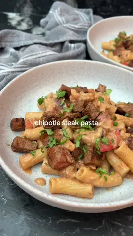 chipotle steak pasta 🤌🏻 steak pastas are my go to when I need a quick and easy meal that tastes absolutely BANGING 😮‍💨 creamy cheesy pasta, smoky juicy steak what is not to love?  558 calories and 39g protein ✅  Add to your favourites for your next dinner 📌 Ingredients (serves 2):  200g rump steak  Smoked paprika  Garlic granules  Onion granules  Salt  Pepper  Tsp chipotle paste  120g dry pasta  Red onion diced Red pepper diced  Oregano  70g reduced fat cream cheese Crumbled beef stock cube  Lime juice  150ml pasta water  40g reduced fat cheddar cheese  Dried parsley  💗Season the steak with a tsp smoked paprika, 1/2 tsp garlic granules, 1/2 tsp onion granules, salt and pepper. Rub in thoroughly before pan frying for a minute each side.  💗Remove from the pan and brush over a tsp chipotle paste.  💗 Add the pasta to boil in a pan of salted water.  💗Fry off the onion, pepper and garlic until softened and then add tsp smoked paprika, onion granules and oregano for a further minute.  💗 Add the cream cheese, crumbled beef stock cube mixing well before adding the pasta water.  💗 Drizzle over some lime juice over the steak before cutting into cubes.  💗 Add the cheese to the pasta sauce mix well and then add the pasta.  💗 Serve with the steak on top and some chopped parsley.  Calories per portion: 558 | Protein: 39.8g | Fat: 18.6g | Carbs: 55.3G  • • __________  #mealideas #EasyRecipes #quickrecipes #highproteinrecipes #steaktok #DinnerIdeas 