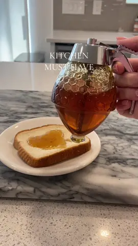 Kitchen must have gadget!🐝🍯🍞 #honeydispenser #kitchenfavs #kitchenfaves #kitchengadget #kortneyandkarlee 