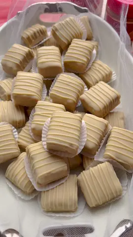 BISCOFF ALMOND BONBONS #food #Recipe #biscoff #almonds #Biscoff #bonbons #cookies #chocolate #fy #fyp #foryoupage #foryou   COOKIE MIXTURE 250 g Biscoff cookies (1 pack) 125 g almonds (peeled) 400 g condensed milk   COATING 300 g white chocolate 40 g Biscoff spread   Chop the Biscoff cookies into small pieces. Chop the almonds into small pieces.   Put the Biscoff cookies in a deep bowl. Add the chopped almonds and condensed milk. Mix until combined.   Spread the cookie mixture evenly into a springform pan or baking pan and press it firmly. Use a sheet of parchment paper between the mixture and your hands to help with pressing. Place the baking pan in the refrigerator and let the mixture chill until it hardens.   Once the cookie mixture is firm enough, cut it into equal pieces.   Melt the white chocolate using a double boiler.   Add the Biscoff spread to the melted white chocolate and mix until smooth.   Dip each piece of cookie mixture one by one into the melted chocolate and then place them on a sheet of parchment paper.   Decorate the bonbons with lines of chocolate and let it fully harden.