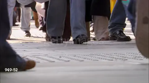 Wide shot legs and feet of pedestrians walking on crowded street carrying shopping bags - HD editalogist video