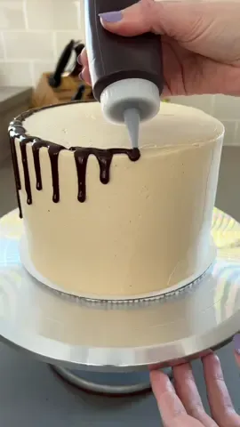 I love making drip cakes! It's an easy way to add some fun and flair to cakes. My preferred way is to use a squeeze bottle, but you can also use piping bags, spoons, or spread it with an offset spatula. Be sure to check out my tutorial on how to make a drip cake on cakemehometonight.com! #dripcake #cakedecorating #cakedesign