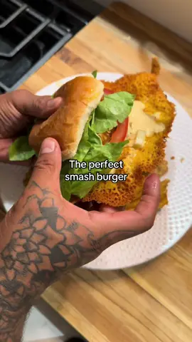 The proper smash burger requires a beautiful cheese skirt! 🧀❤️ Cheese skirt smash burger: Ingredients: 1lb ground beef (I like 90/10) Block of cheddar cheese  Burger buns Romaine Lettuce  Tomate  1 large white onion sliced 2 tbsp butter  Sauce: 1/4 kewpie mayo  Lt splash of jalapeño juice  2 pickle skewers diced 1/2 tsp white pepper or regular  Pinch salt  1/2 tbsp ketchup  1 tsp mustard  1/2 tbsp garlic powder  Directions: 1. Prep your ground meat by shaping into 4 equal sized balls. Set aside. 2. Slice your onions. Add to a hot pan on med low heat w 2 tbsp butter. Sauté for a min until butter is melted, and onions are slightly softened. Then add a splash of water and cover. 3. Let them cook for about 5 mins. The steam will speed up the caramelization process.  4. Once they’re looking softened and a lighter brown color remove lid add a splash of oil and sauté until they’re fully caramelized about 3 mins or so.  5. For your sauce just combine all your ingredients in a bowl. Mix and adjust seasonings to your liking. 6. Shred your block of cheese. 7. Prep your meat. Season the top of the patties. 8. In a hot pan, over med high heat, place your meat seasoned side down. W parchment paper and the back of a spatula firmly press down on the meat to create the smashed patty. Season the top side. 9. Cook for about 3 mins then flip over. It should have a nice char. Let it cook for a min or so. 10. Then cover in the shredded cheese. There should be about a 2in diameter of cheese large than the burger. 11. Let it melt then cover w a lid. Once the cheese on the burger has melted uncover and let the cheese skirt keep cooking.  12. Once the edges are starting to look set remove the burger. Should be about 3 mins.  13. Place your burger w the cheese skirt on warm buns. Top w sauce, lettuce, tomatoes, and caramelized onions. Serve w fries and enjoy babe :)  • • • #smashburger #DinnerIdeas #latenightsnack #munchies #burgerrecipe #cheeseskirt #cheeseburger 