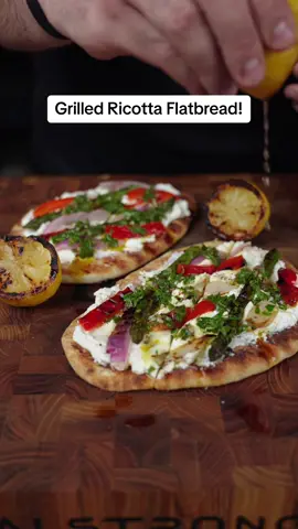 Have you made grilled flat bread before?! It’s one of my favorite ways to use leftover Naan or flatbreads and versions like this are so light and delicious!! Highly recommend trying it!  Ingredients: • Veggies of choice, I used Asparagus, red bell pepper, and red onion.  • lemons cut in half • Olive oil • salt and pepper • garlic or regular naan • whole milk ricotta • optional* Chimichurri for topping Instructions: 1. Get your grill fired up with your favorite charcoal, and head back inside to get your veggies coated in olive oil and seasoned with salt and pepper. 2. Roast the veggies until tender and slightly charred, the first to finish will be the asparagus. I also recommend grilling some lemon halves, they make for a perfect finishing touch!  3. When all the veggies are done, set them aside and grill your naan or flat bread for 1.5-2 minutes!  4. Now we can put it all together starting with our grilled bread, a few dollops of ricotta, a drizzle of olive oil, some salt and pepper, our roasted veggies, and if you have it you can add some chimichurri!  5. Serve with the grilled lemons and enjoy!  #grilledflatbread #grillednaan #grilledbread #roastedveggies #summerrecipe #Recipe #food #Foodie #fyp #foryou 