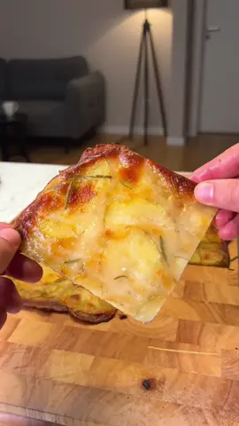 Crispy Potato Flatbread (Schiacciata di Patate) Full Recipe in Bio 5 potatoes 2/3 cup grated Parmesan cheese or 80 grams 1 2/3 cups all-purpose flour (00 type) 200 grams 1 1/4 cups cold water (add more if needed) 300 grams Extra virgin olive oil as needed Fine salt as needed Fresh rosemary or your favorite aromatic herbs as needed Instructions   Prepare the Batter: In a large bowl, mix the all-purpose flour (1 2/3 cups, 200 grams), cold water (1 1/4 cups, 300 grams), grated Parmesan cheese (2/3 cup, 80 grams), a drizzle of extra virgin olive oil, and a pinch of fine salt until you get a smooth and homogeneous mixture. Slice the Potatoes: Thinly slice the potatoes with the help of a mandolin slicer. Carefully incorporate the sliced potatoes into the batter, mixing thoroughly until the potatoes are well coated. Preheat the Oven: Preheat your oven to 400°F (200°C), using the ventilation setting if available. Assemble the Flatbread: Pour and spread the potato and batter mixture into a baking tray lined with parchment paper and lightly oiled to prevent sticking. Ensure the mixture is spread evenly across the tray. For extra flavor, you can add a few more drizzles of extra virgin olive oil and scatter some fresh rosemary leaves (or your chosen herbs) on top. Bake: Initially, place the tray in the lower part of the oven and bake for 20 minutes. Then, move the tray to the middle of the oven and continue baking for another 20 minutes at 400°F (200°C) or until the flatbread becomes crispy and golden brown. Adjusting the tray's position helps achieve an evenly crispy texture throughout. Serve: Once baked to perfection, remove from the oven, let it cool slightly, then cut into desired pieces and serve hot. Enjoy your delicious and homemade Crispy Potato Flatbread, perfect as a unique snack or a complementary side dish!