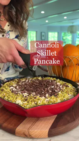 This easy CANNOLI SKILLET PANCAKE (RECIPE BELOW) is perfect for Mother’s Day brunch!! Make a few because they go fast.  For the Pancake 2 cups pancake mix 1 ½ cups water 1 egg Zest from 1 orange ½ tbsp butter For the Cannoli Topping 2 cups ricotta STRAINED OF ANY EXCESS MOISTURE  1 cup mascarpone or full fat cream cheese ⅓ cup powdered sugar 1 tsp vanilla extract  1 cup chopped pistachio 4 ounces dark chocolate shaved -Preheat oven to 350F -Place a 9 inch skillet in the oven and preheat for 10 minutes. -In a large bowl mix together pancake mix, water, egg and zest from one orange.  -Remove the skillet from the oven and add ½ tbsp butter. -Once the butter has melted, add the pancake batter. Bake in the oven on the middle rack for 15 minutes or until golden brown and cooked through. I toothpick inserted into the center should come out clean. -While the pancake bakes mix together the cannoli topping. In a large bowl mix together ricotta, mascarpone, powdered sugar and vanilla. -Once the pancake has cooled to room temp, spread or pipe the cannoli filling all over the top of the pancake.  -Sprinkle the pistachio as shown and shave the chocolate over the center.  #mothersday #brunchrecipe #breakfastrecipe #EasyRecipe #yum #cannoli #skilletpancake #pancake #breakfast 