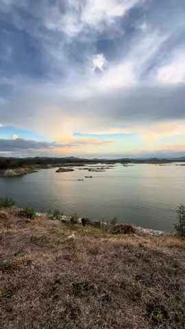 Chasing the golden hour at Magat Dam, where time slows down and nature's canvas comes alive. As the sun dipped behind the rugged peaks, the tranquil waters mirrored the fiery hues, while distant boats gently glided, perhaps carrying fellow wanderers on their own journey of discovery. In moments like these, amidst the quietude of nature's embrace, one finds solace and a reminder of life's simple joys. 🌄 #GoldenHourMagic #NatureLover #MagatDam 