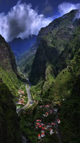🌌 Experience the magic of 📍#RibeiraBrava, Portugal 🇵🇹 Nestled in a valley embraced by towering mountains, this village captivates with its stunning vistas and tranquil ambiance.🏔️ 🎥 @ilya.somewhere #portugal #drone #travel #madeira 