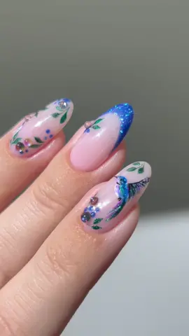🍃🫐🦚🫧 Zendaya ATE!! she definitely won the Met Gala this year, and the fact that she wore not one, not two, but three dresses, plus a fourth one for the after-party 🤯 she woke up all the sleeping beauties! I love her! 💙🌿✨ my nail art is inspired by Zendaya’s first look wearing Maison Margiela by John Galliano  *products used are linked on my amzn in the bio  _____ #metgala #greennails #bluenails #nailinspo #nailtutorials #naildesign #nails #glitternails #flowernails , almond nails , nail art tutorial, shimmery sparkly nails textured 3D glass drops droplets french tips hummingbird garden 