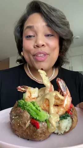 #LoveYouLetsEat Shrimp and Veggie Jacket Potato  Rub potato with olive oil, S&P. Bake for an hour and fifteen minutes at 400°. Slice open and drizzle with melted butter, season with S&P then smear a generous dollop of Boursin on top. Steam broccoli then toss in butter & S&P. Sauté 2 handfuls of spinach in olive oil. Add a pinch of red chili flakes and season with S&P. Sauté bell peppers and onion in olive oil and a small pad of butter. Season with S&P. Season shrimp with S&P, sear one side of the shrimp in olive oil until you get some color, flip the shrimp over, add in a pad of butter and a big squeeze of lemon juice. Turn off the heat and let stand for another minute. For the Cajun Parmesan sauce - In a small saucepan over medium high heat add in about 1/2 c of heavy cream, juice of half a lemon, a splash of water, your favorite Cajun seasoning, a pinch of old bay and about 1/4 c of grated Parmesan. Stir and cook until sauce has slightly thickened. Taste and adjust seasoning with salt if necessary.