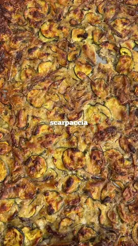ZUCCHINI/COURGETTE SCARPACCIA 🥒 written recipe below 👇🏾  This thin, crispy and chewy Italian tart (or flatbread?) is super easy to make, its full of vegetables and olive oil which makes for a such a tasty treat! 👇🏾method👇🏾 -3 courgettes  -1 large red onion -1 cup plain white flour -big pinch salt n pepper -1 tsp garlic/onion/basil/oregano -few tbsp olive oil 👇🏾method👇🏾 -thinly slice the courgette and onion then salt and leave to sit for up to 2hrs. -squeeze out the liquid from the veggies, then mix with the flour and seasonings before adding the veggies. You want a wet batter so add more liquid/less flour if necessary. -place on a oily greased tray, flaten and spread out evenly, oil on top then bake for 45mins @ 200°, allow to cool slightly then serve and enjoy. #scarpaccia #italy #italian #italianfood #courgette #zucchini #tart #Recipe #recipes #food #vegetables #baking #baker #EasyRecipe