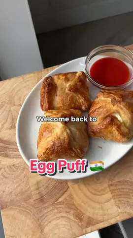 WELCOME TO EGGS FROM AROUND THE WORLD 🍳🌍 welcome to eggs from around the world. my brand new mini series where I’ll be showing you how to make the best egg dishes the world has to offer.. this is episode 7 where will be taking a trip to India, to make some Kerala Egg Puff ! Full recipe below (Makes 6 egg puffs) 3 eggs hard boiled 1 tbsp ghee Thumb of ginger diced 3 garlic cloves diced 1 green chilli diced 1 red onion sliced 3 medium tomatoes diced 1 tsp kashmiri chilli powder 1/2 tsp turmeric  1 tsp garam masala 5 curry leaves 1 tsp black pepper 1 tsp salt 100ml water Sheet of puff pastry 1 egg for egg wash Step (1) In a larger skillet, heat up 1tbsp ghee, then add the diced ginger, garlic and chilli. Saute for 30 seconds on a medium heat, then add the sliced onion. Season with salt and cook for 5 minutes on a medium heat until soft Step (2) Add the tomatoes, then season with chilli powder, turmeric, garam masala and curry leaves, mix well and cover for 10 minutes. The tomatoes should be crushed and had released its juices. Now remove the lid and add 100ml water and let simmer uncovered for a few minutes until it reaches a thick stew consistency, set aside and allow to cool until it reaches room temperature Step (3) Pre heat the an oven to 180C. Layer you puff pastry into large squares, add a tsp of the masala followed by half a boiled egg, fold the pastry until you form a box, then brush with the egg wash. Repeat for each puff, then place in the oven and bake for 15-20 minutes, until crispy and flakey. Serve with some ketchup or hot sauce, enjoy :) #egg #eggrecipe #indianfood #desifood #series #fyp 