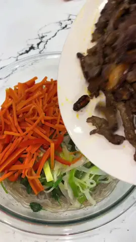 This is japchae which is korean glass noodle stir fry. I consider this a main dish.. its easy to make BUT time consuming cause everything is cooked separately 