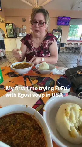 My first time trying FuFu with Egusi soup in the USA🇺🇸 at a African Cuisine Restaurant ( Popular West  African meal, cooked wirh grounded melon seed, vegetables including spinach, palm oil, other vegetables & seasonings. Served with pounded yam. BASE VEGETARIAN ( meat side option) I liked it & I ate it all 😃 It is different from the FuFu I ate in Ghana🇬🇭 This FuFu was more of a huge ball of mashed potatoes, so it was easier to swallow with the thicker Egusi soup which i would consider to be more of a stew then a soup because of it being thicker. I ate my FuFu with my fingers since thats the only way I know from being in Ghana🇬🇭  & when my FuFu was gone i used a spoon that was provided to eat the rest of my Egusi soup 😃✌️🙌 I am willing to try new foods & I give this a good reveiw & it was not too spicy  #fufuandegusi #fufu #egusisoup #egusi #foodreview #AfricanFood #poundedyam #westafricanfood #africatiktok #ghanatiktok🇬🇭 #nigeriatiktok🇳🇬 #usatiktok🇺🇸 #reels__tiktok #videostiktok #foodvideo #africanrestaurant #usa🇺🇸 