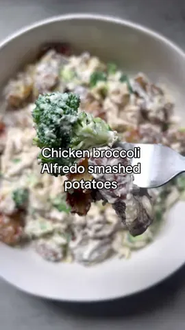 So banging you have to try this smashed Alfredo potato salad the end 😀  Ingredients *  1 lb baby potatoes *  rosemary lemon olive oil *  1 tbsp ranch seasoning *  1 tbsp sea salt  *  Fresh herbs (optional, for garnish) * 8 chicken tenders shredded  * 1/2 cup shredded cheddar cheese  * 1/4 cup grated Parmesan * 1/4 cup chicken broth * 165g Philadelphia light soft cheese  * 1 cup of chopped broccoli (blanched or cooked to your liking. * 1/4 cup light double cream  * 1 tbsp cracked pepper  Instructions Boil the Potatoes: Place the baby potatoes in a pot and cover with water. Add a pinch of salt. Bring to a boil and cook until the potatoes are tender about 10-15 minutes. Drain and let them cool slightly. Smash the Potatoes: Preheat your air fryer to 205°C. Place the potatoes on a cutting board or baking sheet. Using the bottom of a glass or a potato masher, gently press down on each potato to flatten it but keep it in one piece. Air Fry the Potatoes: Arrange the potatoes in a single layer in the air fryer basket. You might need to do this in batches depending on the size of your air fryer. Season the Potatoes: Spray or drizzle the oil, and add raunch seasoning and sea salt. Cook for 20 minutes at 180°, flipping halfway through, until the potatoes are crispy and golden brown. Whilst that’s cooking to a bowl add the shredded chicken, broccoli, Parmesan, cheddar cheese, chicken broth, soft cheese and cracked pepper Mixed well till everything is combined. Remove potatoes from the air fryer transfer to a serving platter with the Alfredo sauce and mix well till everything is coated.  Garnish with fresh herbs if desired, and serve immediately. Alternatively, you can add some of the potato salad to a tray, add cheese on top and bake for five minutes.  #mands #potatosalad #smashedpotatoes #easycooking #foru 