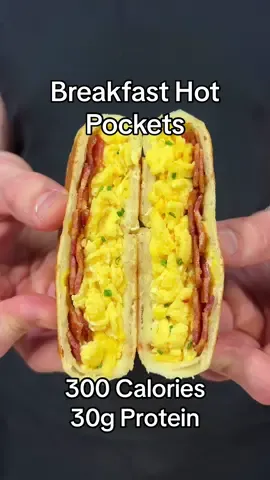 Breakfast Hot Pockets 🧇  (Makes 8 Hot Pockets)  If you like this recipe, make sure to check out my digital cookbook that has 100+ delicious recipes like this one! Your support means that I can continue posting these recipe on my page for free. Link in my bio!  Macros:  - 300 Calories - 30g Protein  - 25g Carbs  - 8g Fat  Ingredients:  - 2 Cups Self Rising Flour  - 1 1/4 Cups Greek Yogurt (0% Fat)  - Garlic Salt  - 10 Center Cut Bacon Strips  - 8 Eggs  - 1/2 Cup Egg Whites  - Fresh Chives  - 2 Cups Fat Free Mozzarella  #cooking #food #Fitness #weightloss 