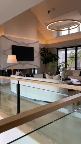 Anchored by a fireplace, the open, airy Great Room in our Sunlit Coastal Ranch home has natural lighting with clerestory windows and views on both sides of the home. #livingroom #greatroom #fireplace #fireplacedesign #livingroomdesign #dreamhome #dreamhouse #luxuryhomes #architecture #architect #interiordesign #interiorarchitecture #foryoupage #customhome #customhomes 