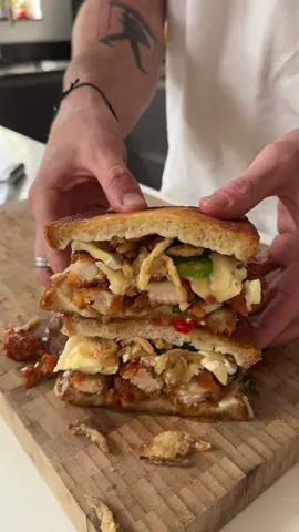 Hot Honey Chicken Tender Toastie 🫡 Started with a base of a mozzarella toastie then added: • Homemade chilli and garlic hot honey  • Fried chicken tenders tossed in hot honey • Brie  • Fresh jalapeños • Crispy onions • More hot honey #food #foodporn #foodphotography #foodblogger #Foodie #dublinfood #dublinfoodblog #dublinfoodie #sandwich #chicken #chef 