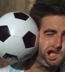 Soccer ball to face. Super slow motion.