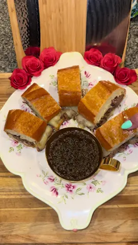 French Dip Sandwich🥖🥩 #Recipe #food #cooking #sandwich #frenchdip #DinnerIdeas  In a slow cooker add: -1 medium onion (roughly chopped) -11 cloves of garlic  -4 sprigs of rosemary  -1 cup of red wine  -2 cups of beef stock  -2 tablespoons of Worcestershire sauce  -2 tablespoons of soy sauce  Then get a 3 to 4 pound Chuck Roast, pat it dry with a paper towel, season it with some salt, and brown it (on all sides) in a pan on medium heat.  Then add it into your slow cooker and season generously on both sides with:  -beef bouillon powder -salt and pepper -granulated garlic Cook on low 8 hours. While it’s cooking, you’re going to make some caramelized onions by adding 5 tablespoons of butter to a pan on medium-low along with 5 medium onions cut into half moons.  Cook them for about 1 hour stirring frequently, and season them with salt and pepper.  Once the beef is done, separate it from the liquid and shred it all up in a bowl. Then stir in the caramelized onions.  Then strain all of the juice from your slow cooker and set it aside (this is the Au Jus that you’ll be dipping the sandwich in) Lastly, in a bowl make a quick spread by combining: -1/2 cup of mayo -3 tablespoons of cream style horseradish  -salt and pepper to taste Then you’re going to get a large French Baguette, and cut it down the middle (like you would cut a sub sandwich) Add on the spread, then add the beef, top it with Swiss cheese, then close and cover it tightly with foil.  Bake in the oven at 325 degrees for 10 to 15 minutes or until the cheese melts.  Then cut it into small sandwiches and serve them straight out of the oven with the delicious Au Jus on the side.  Enjoy💜