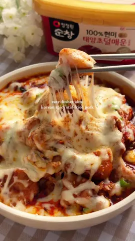 spicy stir-fried pork🌶️🥵 #koreanfood #spicyfood #koreanrecipe #stirfry #koreantiktok  this recipe is done in less than 30 mins and in one pan! recipe:  1 lb pork belly   4 tbsp gochujang   1.5 tbsp soy sauce   1 tbsp oligo syrup   1 tbsp cooking wine   2 tbsp gochugaru   1/4 tsp black pepper   1 tbsp sesame oil   6 minced garlic cloves   1 tsp minced ginger   1 sliced medium onion   4 sliced green onions   garnish:   sesame seeds   green onions   mozzarella cheese   instructions:   clean the pork belly with cooking wine to remove any impurities.   rinse the pork belly thoroughly with water.   pat it dry with paper towels.   cut the pork belly into bite-sized pieces.   slice and mince the vegetables (onions, green onions, ginger, and garlic).   in a large skillet, add the pork belly with the sauce ingredients (gochujang, soy sauce, oligo syrup, cooking wine, gochugaru, black pepper, and sesame oil).   stir fry for 3-4 mins before adding in the vegetables (minced garlic, minced ginger, sliced green onions, and onions).   stir-fry for about 7-10 minutes, until the pork is cooked through.   transfer the stir-fried pork to a serving plate.   garnish with additional sesame seeds and green onions if desired.   serve hot with steamed rice and other korean side dishes like kimchi, pickled radish, or cucumber salad.   optional cheese:   if you want to add cheese, you can torch the cheese until it melts.   alternatively, reduce the skillet heat to low, sprinkle the shredded cheese evenly over the top of the stir-fried pork belly, then cover the pan with a lid and let the cheese melt for 2-3 minutes, until it becomes gooey and delicious. this is recipe 2 of my “1 kg gochujang tub challenge” series where i attempt to make recipes to use up all 1kg every tuesday! 🌶️ 1kg mild gochujang tub is from @ofoodusa 