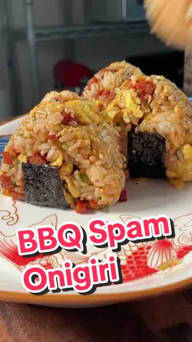 The perfect picnic food!  🍙 Ingredients:  -1 cup rice, cooked -½ can Spam, cubed -1 Tbsp soy sauce -1 Tbsp sugar -2 Tbsp bbq sauce -3 eggs -spray oil  -4 Tbsp furikake Garnish:  -chives -kewpie mayo -seaweed strips Steps:  1. Cook rice according to package instructions and set aside to cool. 2. Cube spam into small bites, set aside.  3. In a large pan on medium heat, spray with cooking oil before adding spam. Toast on all sides until slightly brown, about 3 minutes.  4. Add in the soy sauce, sugar, and bbq sauce, and cook for another 3 minutes or until the sauce thickens to liking. Remove and set aside. 5. In a bowl, mix your eggs to scramble.  6. In the same pan over medium heat, spray with cooking oil and scramble the eggs until set, about 1 minute. Set aside.  7. In a large mixing bowl, combine cooled cooked rice with spam, scrambled egg, and furikake.  8. Mix well and form into round balls.  9. Wrap the rice balls with the seaweed strips and top with kewpie and chives.  10. Enjoy immediately! @Sarah #spam #onigiri