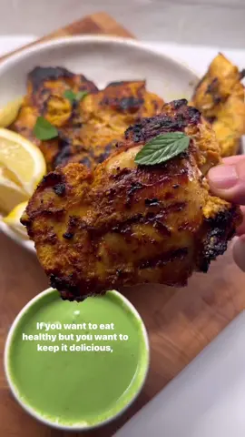 GRILLED “TANDOORI” CHICKEN . This homemade tandoori inspired chicken and mint chutney sauce are just the perfect match - I had this chicken for both lunch and dinner today because it was THAT good. . As always, try to let the chicken marinate well (at least 6 hours, ideally even a full day). I used a charcoal grill for these, but you can airfry, pan fry, or even bake them in the oven. . Here is how I made it: . 1.Start with 2 lbs boneless skinless chicken thighs. Place in a large bowl. . 2.Process together half a large yellow onion, 4-6 garlic cloves, and a knob of ginger in a small food processor. . 3.Add the processed mixture on top of the chicken. Top with 2 heaping TBSP of a plain yogurt, 2-3 pinches of salt, fresh cracked pepper, 1 tbsp tandoori spice mix or a curry powder, 1 tbsp sweet paprika, and 1/2 to 1 tsp of cayenne pepper. Mix it really well, then let it marinate 6-24 hrs. . 4.When you’re ready to make these, you can grill, air fry, or pan fry them. I grilled these for about 5-7 mins  per side since they taste the best that way. To air fry these, add them your airfryer for 18-20 mins at 400F (time varies by thickness and your airfryer), or cook them up on cast iron pan. . 5.To make the mint chutney inspired sauce, grab a large high speed blender, add 1 large handful of mint (about 2 cups), 1 large handful of cilantro (about 1 to 1.5 cups), 3/4 cup plain yogurt, a small knob ginger, 1 or 2 chili peppers or 1/2 jalapeno (optional for spice), juice of 1 lime, 1/2 tbsp tandoori masala or Garam masala spice, 1/2 tsp cumin, and a couple generous pinches of salt. Process well, taste and adjust. . 6.Plate up the chicken, serve it with fresh lemon wedges and the sauce. You can serve it up over rice, quinoa, or if you’re lowcarb, my @Kaizen Food Company lowcarb rice. . ENJOY! . . . . . #lowcarb #lowcarbrecipes #keto #ketorecipes #healthyrecipes #goodmoodfood #healthyfoodshare #whatsonmyplate 