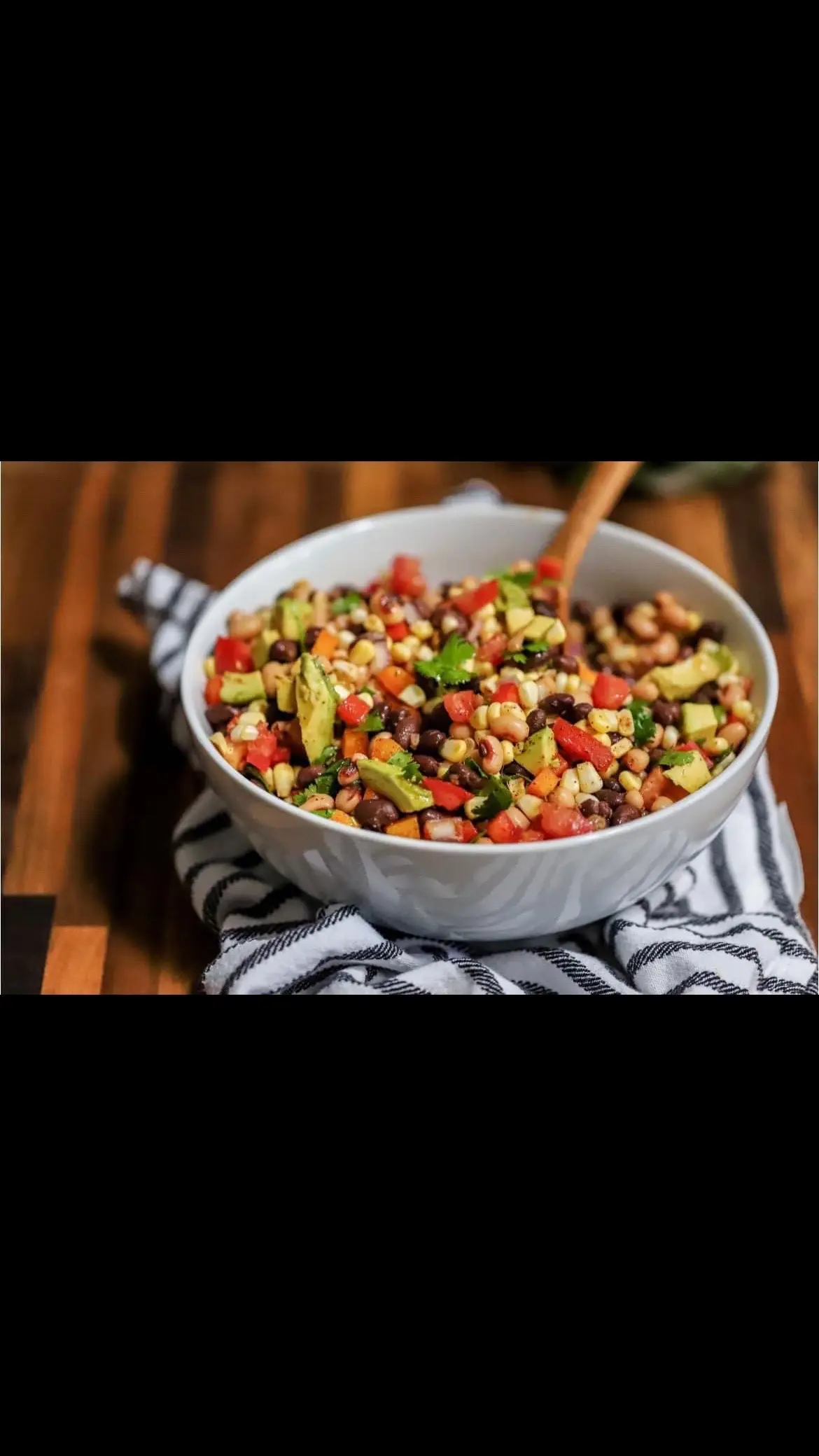 This dish is on repeat all summer! This recipe for cowboy caviar is easy, fresh, colorful, and adaptable. #Cowboycaviar can be used as a salsa (it is soooo good with tortilla chips!), a salad, a side dish, as part of a burrito bowl, or even as a topping on a salad–the possibilities are endless! Cowboy caviar, which is a cross between a salsa and a bean salad, is delicious, healthy, and lasts about five days (if you don’t finish it all before then!) Save this recipe, and share with a friend! Ingredients 1 can black beans, rinsed and drained 1 cup tomatoes, finely diced 1 cup corn (thawed from frozen or fresh) 1 avocado, chopped 3/4 cup red bell pepper, diced 3/4 cup orange bell pepper, diced 1/2 cup red onion, finely diced 1/3 cup cilantro leaves, chopped 1/3 cup of olive oil 1/4 cup of lime juice 1 tablespoon of honey 1 teaspoon of chili powder 1 teaspoon of  cumin salt and pepper to taste Instructions Place the beans, tomatoes, corn, avocado, bell peppers, onion, and cilantro in a large bowl.  In a small bowl, whisk together the olive oil, lime juice, honey, chili powder, cumin, and salt and pepper. Pour the dressing over the bean mixture and toss gently to coat. Refrigerate if not immediately serving!  #fyp #mukbang #caviar #protein #highprotein #zeropoint #zeropointww 