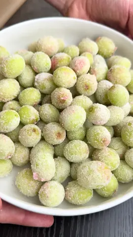 FROZEN CANDY GRAPES 💚  Ingredients: 3 1/2 cups seedless green grapes (530 g) 1 lime juiced (~2 tbsp) 1 0.6oz package Jell-O mix - I use sugar free pink starburst flavor Instructions: 1. Wash and dry the grapes and line a baking sheet or tray with parchment paper. 2. Add the grapes to a bowl and add the lime juice, stirring to coat all of the grapes. 3. Add jell-o mix to a small bowl. Working in small batches (I do about 4-6 grapes at a time), roll the grapes in the jell-o until thinly coated and set on the parchment lined tray. 4. Transfer grapes to freezer and freeze for 2-3 hours. Enjoy! Notes: • Work in batches: Coat just a few grapes at a time (I do about 4-6) to avoid too much clumping of the jell-o mix. You can also use a spoon to help not get as much on your fingers. This way, all of the mix is used for the amount of grapes. • Keep in the freezer: Store in an airtight container or plastic bag in the freezer. Per 1/2 cup (~80g): 65 cals 2P 15C 0F #sweettreats #grapes #jello #EasyRecipe 
