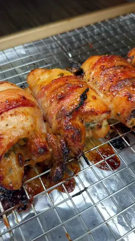 Outback honey mustard dressing chicken thighs and  bacon!! Ingredients: 4 boneless skinless chicken thighs  4 pieces of bacon 1 tsp onion powder 1 tsp Lawrys seasoning salt 1 tsp dried parsley  1 tsp garlic powder 1/2 tsp smoked paprika  Salt & pepper  3/4 cup mayo 1/4 cup honey 2 tbsp dijon mustard Directions: Mix together onion powder, Lawrys seasoning salt, dried parsley, garlic powder, smoked paprika, black pepper, a pinch of salt, and pat seasoning blend into the back and front of the chicken thighs. To make the Outback honey mustard sauce mix together mayo, honey, and dijon mustard. Use about 1/4 of the honey mustard sauce to coat both sides of the chicken and set aside the rest of the sauce for later.   Roll your chicken up and take one piece of bacon and wrap it around the rolled up chicken and top with black pepper. Repeat this process on the other pieces of chicken.  Place the bacon wrapped chicken on a rack on a baking sheet and bake at 450°F for about 30 minutes. 20 minutes into the cooking time take chicken out of the oven and baste it with some of the honey mustard sauce, then put back into oven to finish cooking. Serve over mashed potatoes and top with parsley and honey mustard. Enjoy!!!   #outbacksteakhouse #honeymustard #baconwrapped #bonelesschickenthighs 