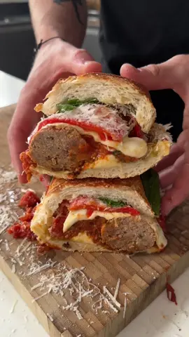 Meatball Sambo 🫡 Started with a base of a mozzarella stuffed crispy roll then added: • Pesto • Meatballs in sauce • Mozzarella  • Roasted red peppers • Parmesan • Fresh basil #food #foodporn #sandwich #nyc #chef #meatballs
