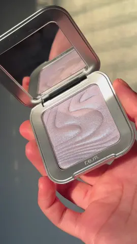 highlighters you can see from space….all the way to to neptune……⚛️🛸 — @r.e.m. beauty beautiful icy purple “interstellar highlighter topper” in shade “miss neptune” is perfect for all over the face to get that beautiful glow from within look, or to really stand out on a night out! she’s beautiful on the body too 😉! #rembeauty #arianagrande #remflightcrew #beauty #highlighter #makeup #glitter 