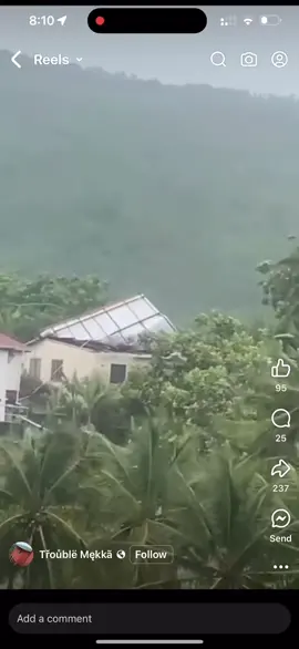 This guy is holding down his roof while another oke is ontop of tne roof trying to save it. #hurricane #stvincentandthegrenadines #hurricaneberyl #hurricaneseason #prayers 