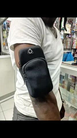 My part-time model 🤣 @G-CHESS Workout Gym Arm band to hold your phone. It has two pockets. It has an adjustable strap.  Gym accessories. Phone holder. Outdoor running cycling arm pack fitness training wrist band.  #mapambohouseholds  #nairobitiktokers #mombasatiktokers #Fitness #armband