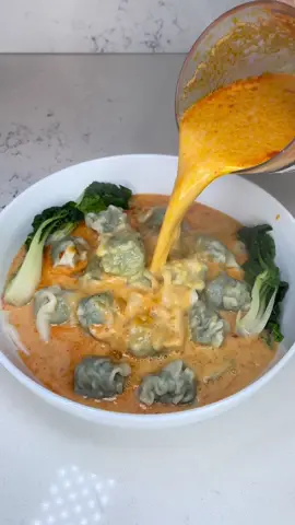 Red Thai Curry Wonton Soup 😮‍💨🌶️🥟 Full recipe below!  inspired by - @Brendan Pang | Cook & Author  • 2 tbsp annatto oil (or olive oil)  • 1/2 yellow onion, diced  • 2 tbsp minced garlic  • 4-6 oz red curry paste  • 8 cups (2 cartons) chicken stock or broth  • 2 cans coconut milk  • 2-4 tbsp sugar, depending on desire sweetness  • about 3 tbsp fish sauce, or to taste  • juice of 2 limes  • 2 bags frozen wontons /dumplings  Toppings/Add-ins  • green onions, sliced  • lime slices  • thai basil  • bok choy  - to a large pot add oil & diced onions; sauté until translucent  - add minced garlic & sauté until fragrant  - stir in curry paste & let cook down for 2-3 mins  - stir in chicken broth & coconut milk; bring to a simmer  - add fish sauce, sugar & lime juice; taste & adjust sugar for sweetness & fish sauce for saltiness  - let broth simmer while you prepare wontons  - in a separate pot add water; once boiling, add wontons & bok choy (bok choy is optional)  - let wontons & bok choy cook for about 4 mins or until wontons are fully cooked  - add wontons & bok choy to a bowl then add broth; serve topped with lime juice & sliced green onions  #wontonsoup #redthaicurry #recipesoftiktok #comfortfood 