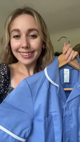 Nurse uniform try on ✨🩵  What do we think of the dress? After 6 years of being in tunic and trousers as a STN and now an RN, the dress is definitely a different vibe. I cant decide if I love it or hate it 😂👗 Let me know in the comments 💬 #nurse #nursing #uniform #dress #tunic #nhs #uk #blues #community #district #student #nursesoftiktok #nurselife #tryon 
