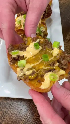 Cheeseburger Garlic Bread is an easy dinner recipe the whole family will love!  INGREDIENTS  1 lb ground beef  1 chopped onion  1/2 tsp each of salt and pepper  1 tsp each onion powder and paprika  1 TBSP minced garlic  1 box garlic bread  Shredded cheddar cheese  Burger Sauce (1/2 cup mayo, 1/4 cup ketchup, 1/8 cup mustard, 1 TBSP sweet relish) 2 Chopped green onions  INSTRUCTIONS  Bake garlic bread in the oven following the directions on the package. I like to bake it a little bit longer than it calls for, so it is more toasted.  Make homemade burger sauce by stirring together mayo, ketchup, mustard, and sweet relish. Set aside.  Brown ground beef and onion in a skillet over medium high heat and add all seasonings. Once the beef is browned, drain grease, and add minced garlic. Stir well.  Add ground beef mixture on top of garlic bread.  Add cheese on top and put back in the oven to melt the cheese. Top with the homemade burger sauce and some chopped green onions. Enjoy! #EasyRecipes #easyfood #dinner #groundbeef #cheeseburger 