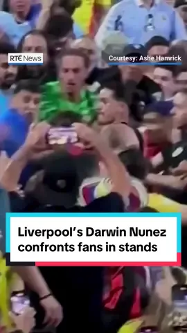 Liverpool footballer Darwin Núnez was involved in a fight with Colombian supporters in the stands after Uruguay's Copa America semi-final loss. TV cameras and fans captured images of Nunez climbing railings to get into the stand at the Bank of America Stadium in North Carolina. He could then be seen confronting supporters as the police tried to intervene. Other Uruguay players were involved in the incident, with Uruguay captain José María Giménez claiming that they were protecting their families. South American governing body CONMEBOL said it had launched an investigation. Nunez was seen hugging his son on the pitch after the altercation. #uruguay #darwinnuñez #darwin #colombia #copaamerica #rtenews #lfc #liverpool 